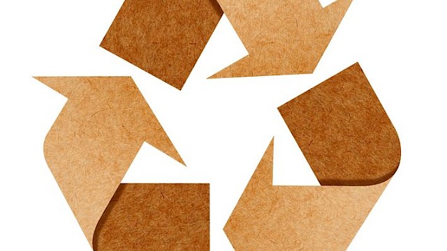 Recycling symbol in brown card material