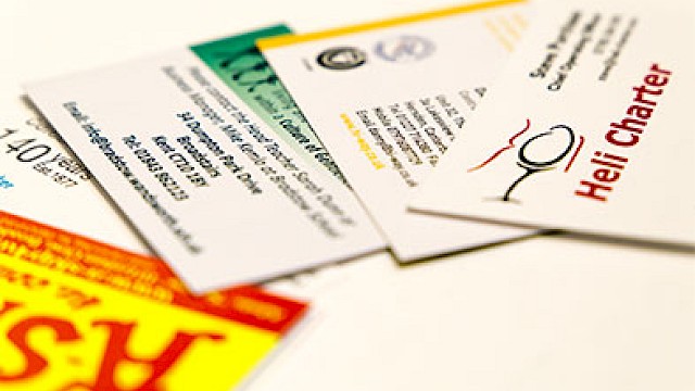business cards on top of each other with logos showing